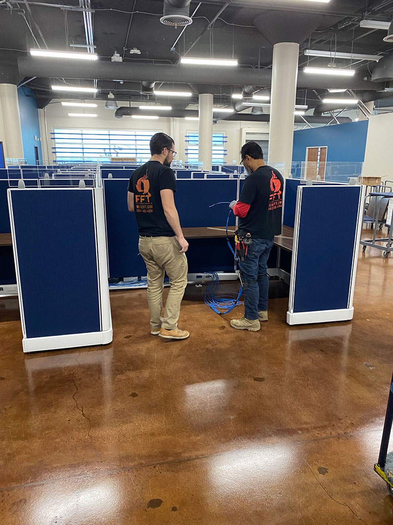 FFT technicians installing network cabling at the Central Neighborhood Health Foundation headquarters